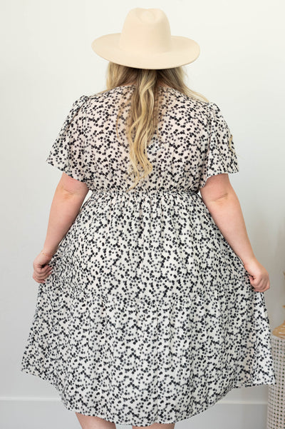 Back view of a plus size ivory dress