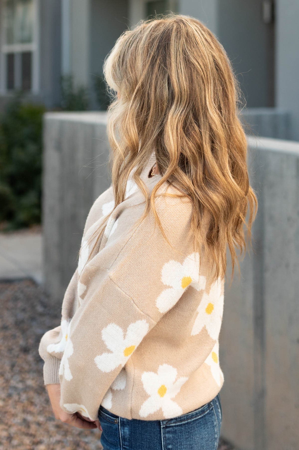 Side view of a beige sweater