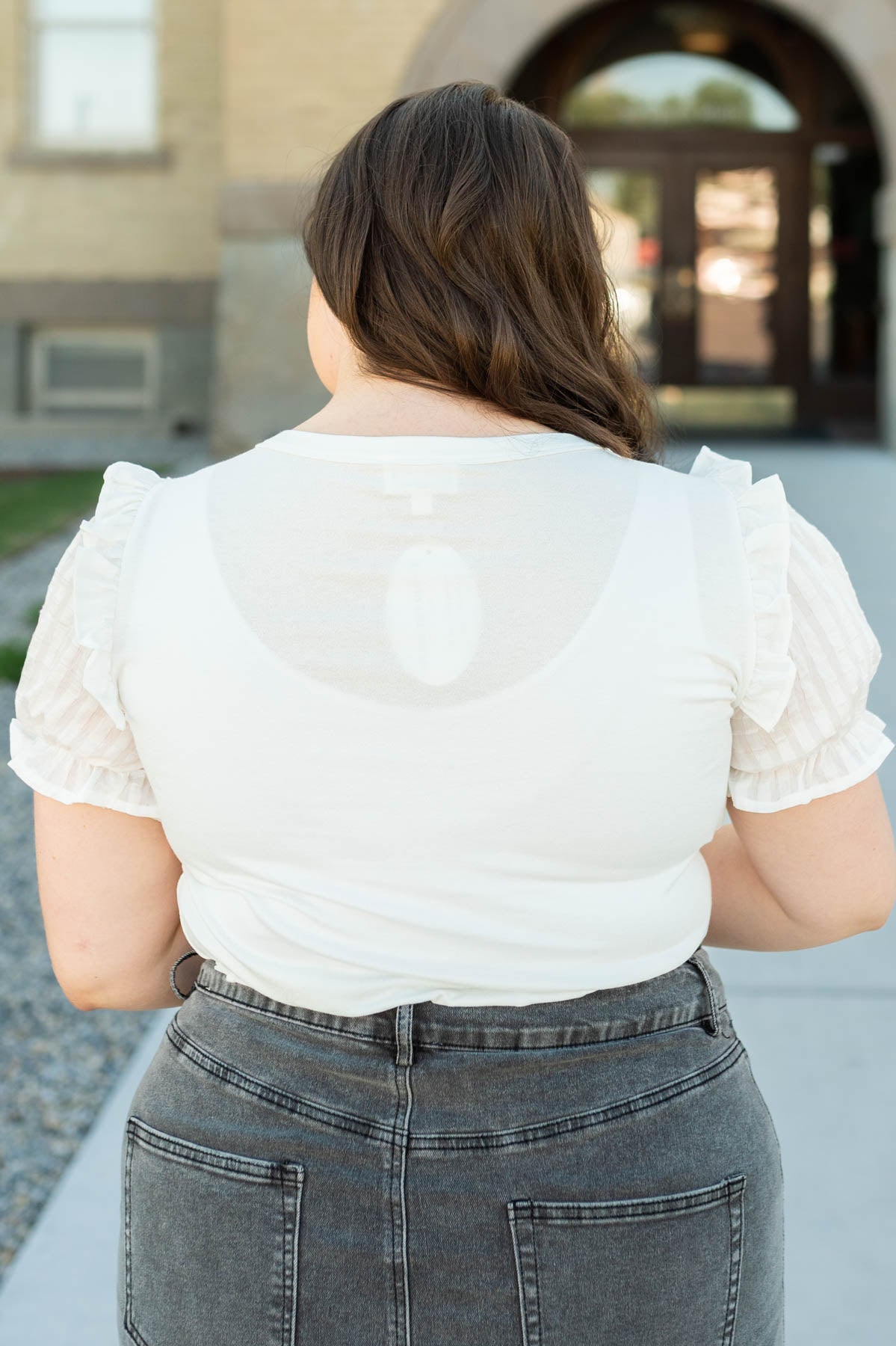 Back view of a plus size short sleeve top