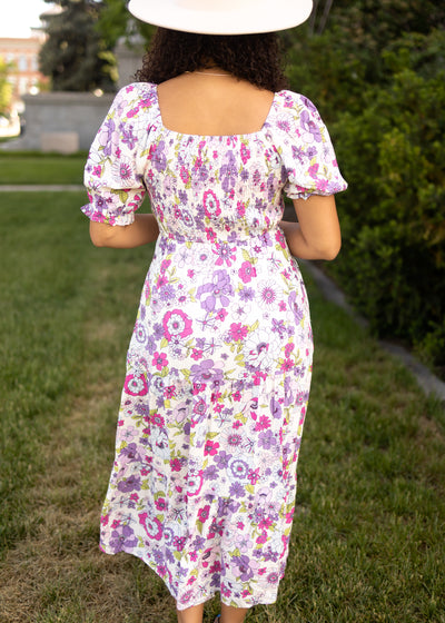 Back view of a short sleeve purple floral dress