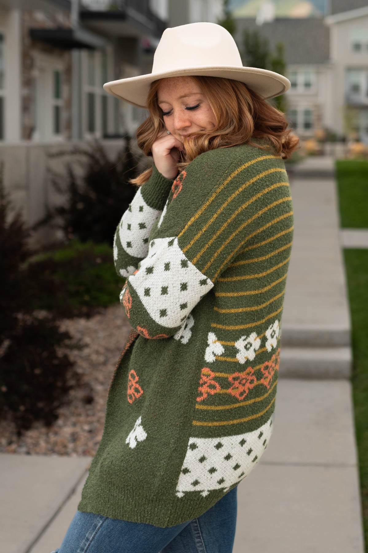 Side view of a olive cardigan