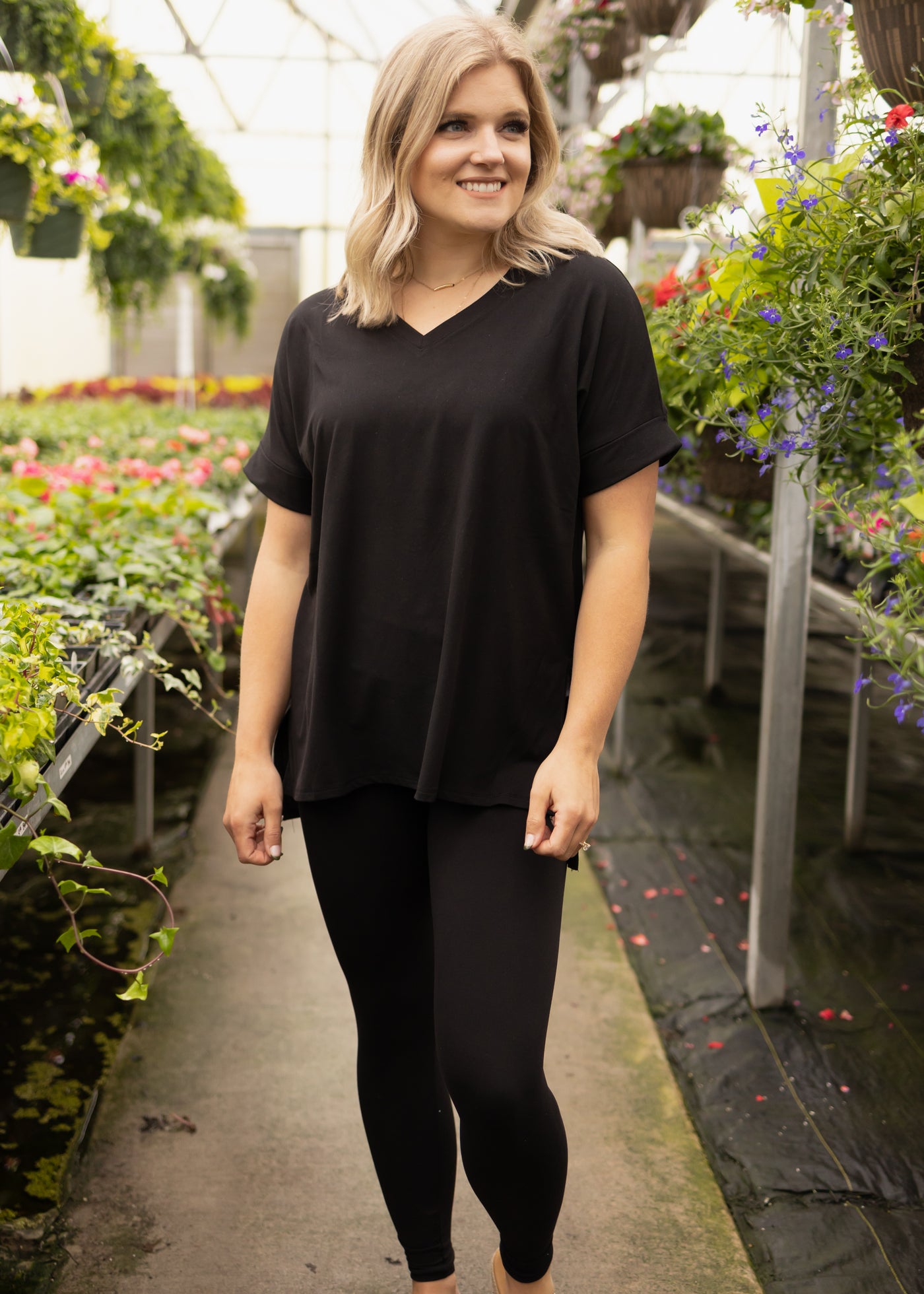 Front view of a black legging set with short sleeves