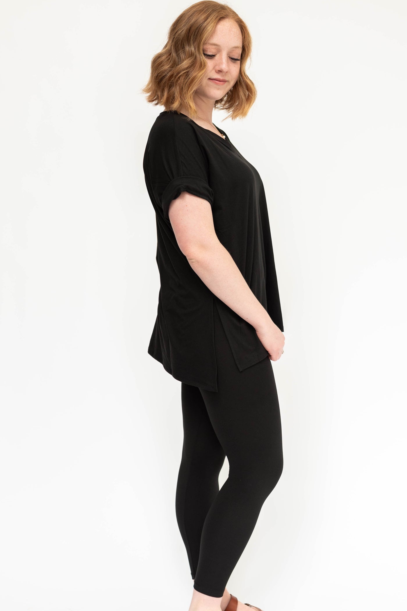 Side view of a black legging set with over size top