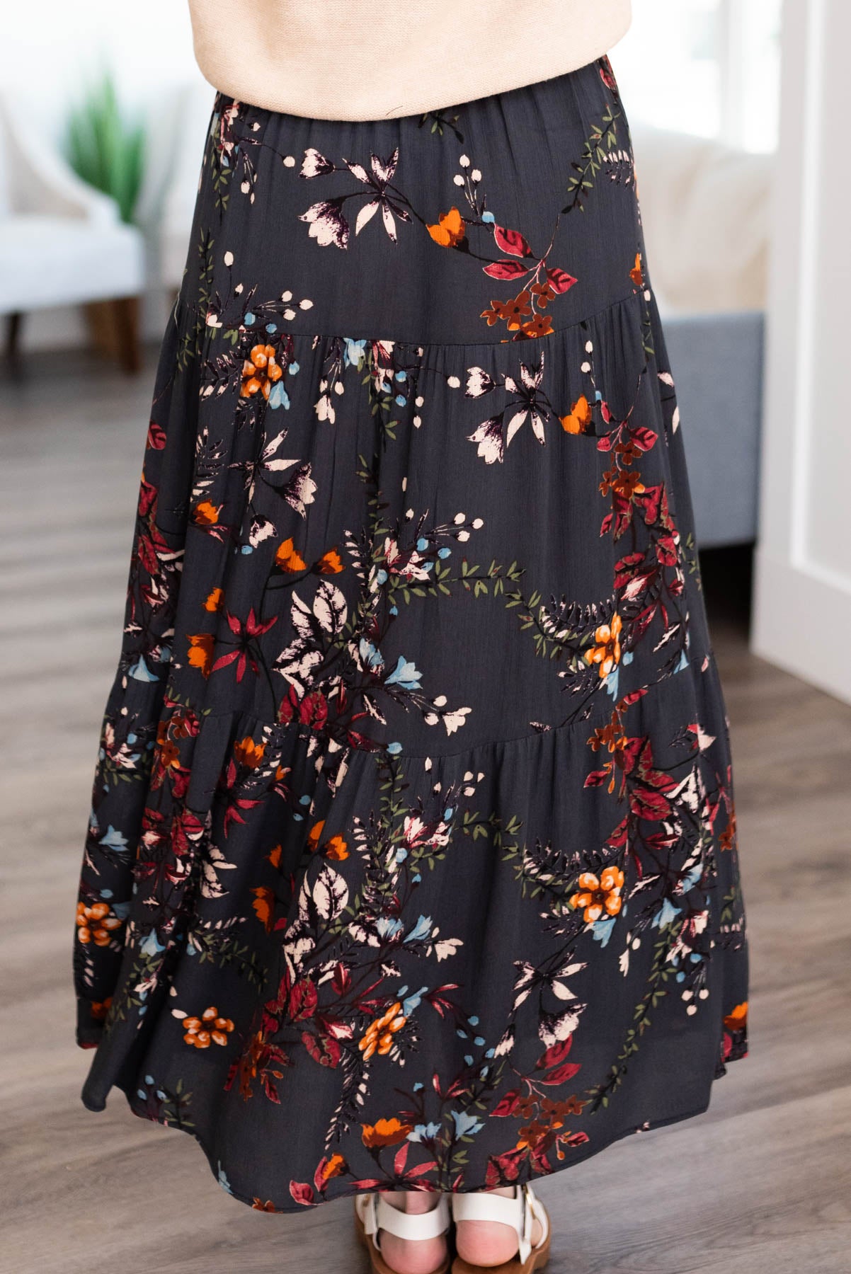 Back view of a dark teal floral skirt