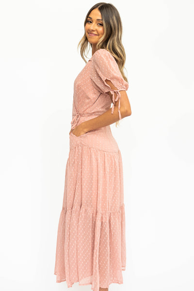 Side view of a blush wrap dress