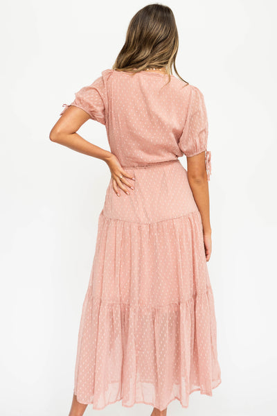 Back view of a blush wrap dress