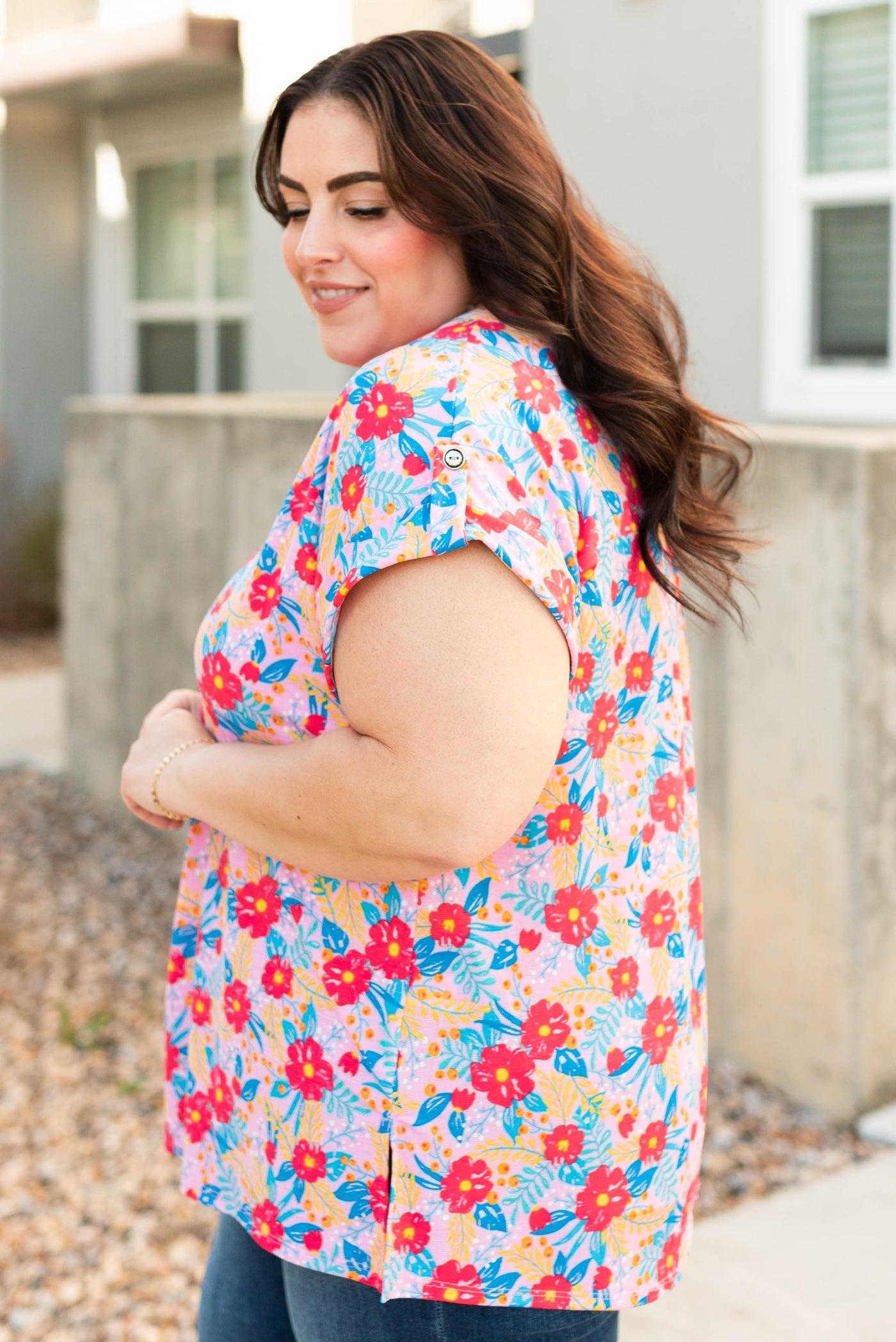 Side view of the plus size blush multi floral top