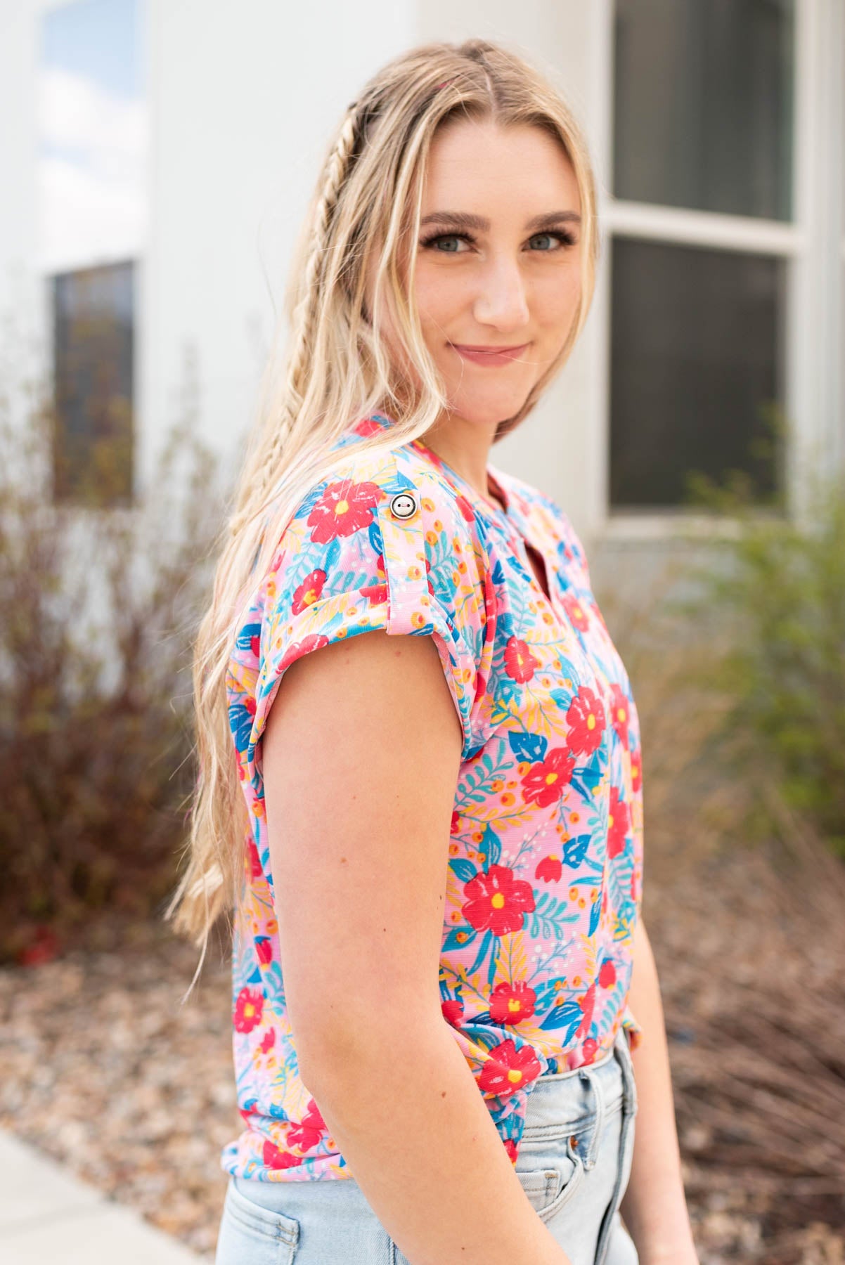 Side view of the blush multi floral top