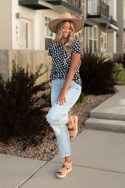 NIco light wide leg jeans that button up and have a frayed hem