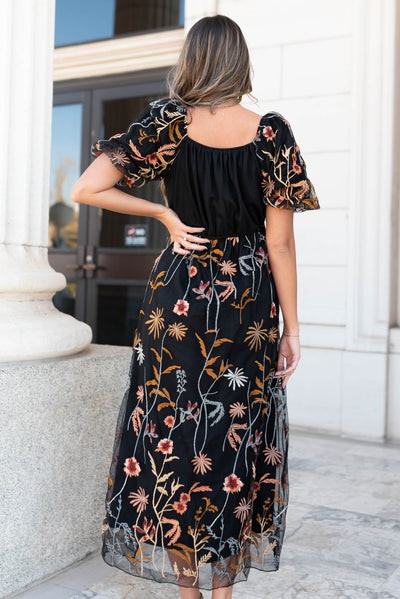 Back view of the black embroidered dress