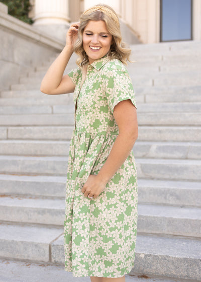 Green floral dress with buttons on the bodice
