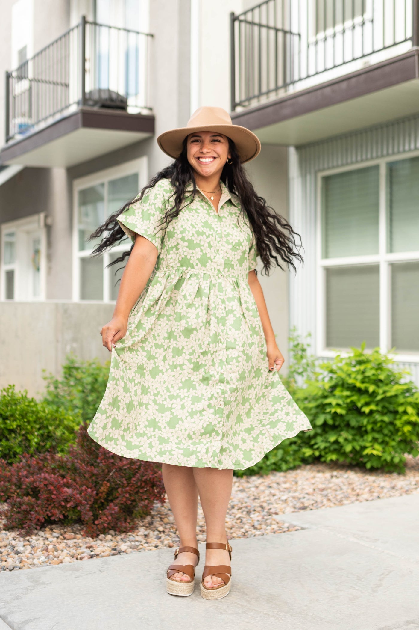 Green floral dress with buttons on the bodice