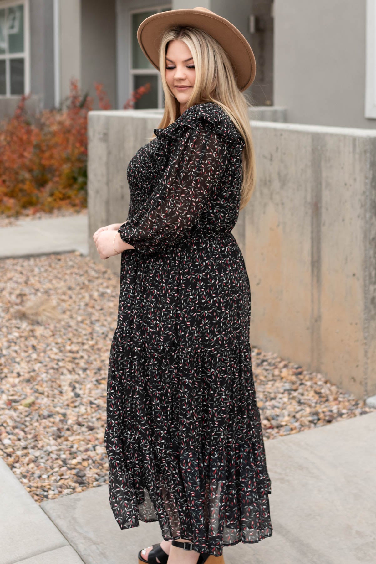 Side view of the plus size black floral dress
