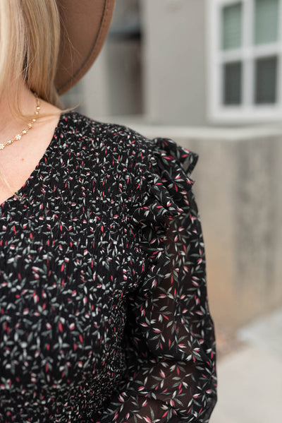 Close up of the fabric on the black floral dress