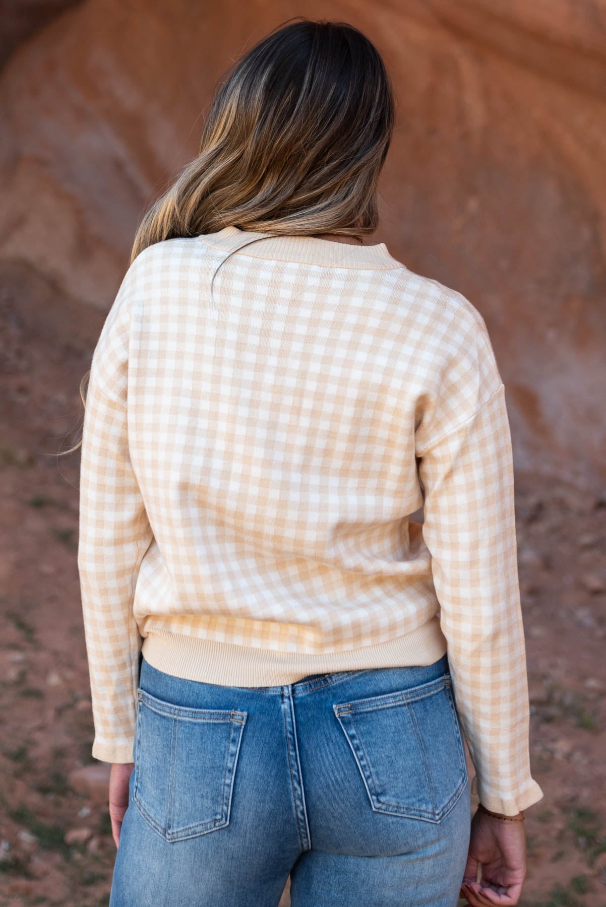 Back view of a ivory sweater