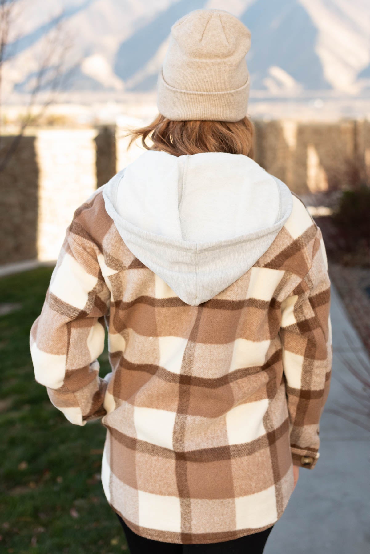 Back view of a taupe button down shacket