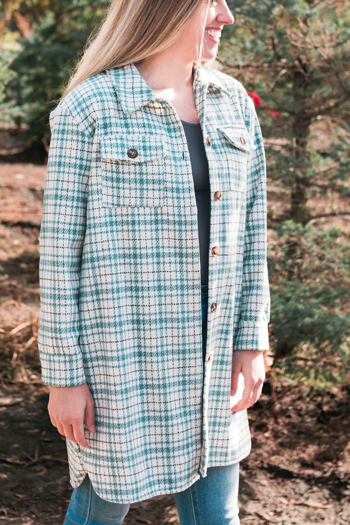 Side view of the green plaid coat with buttons