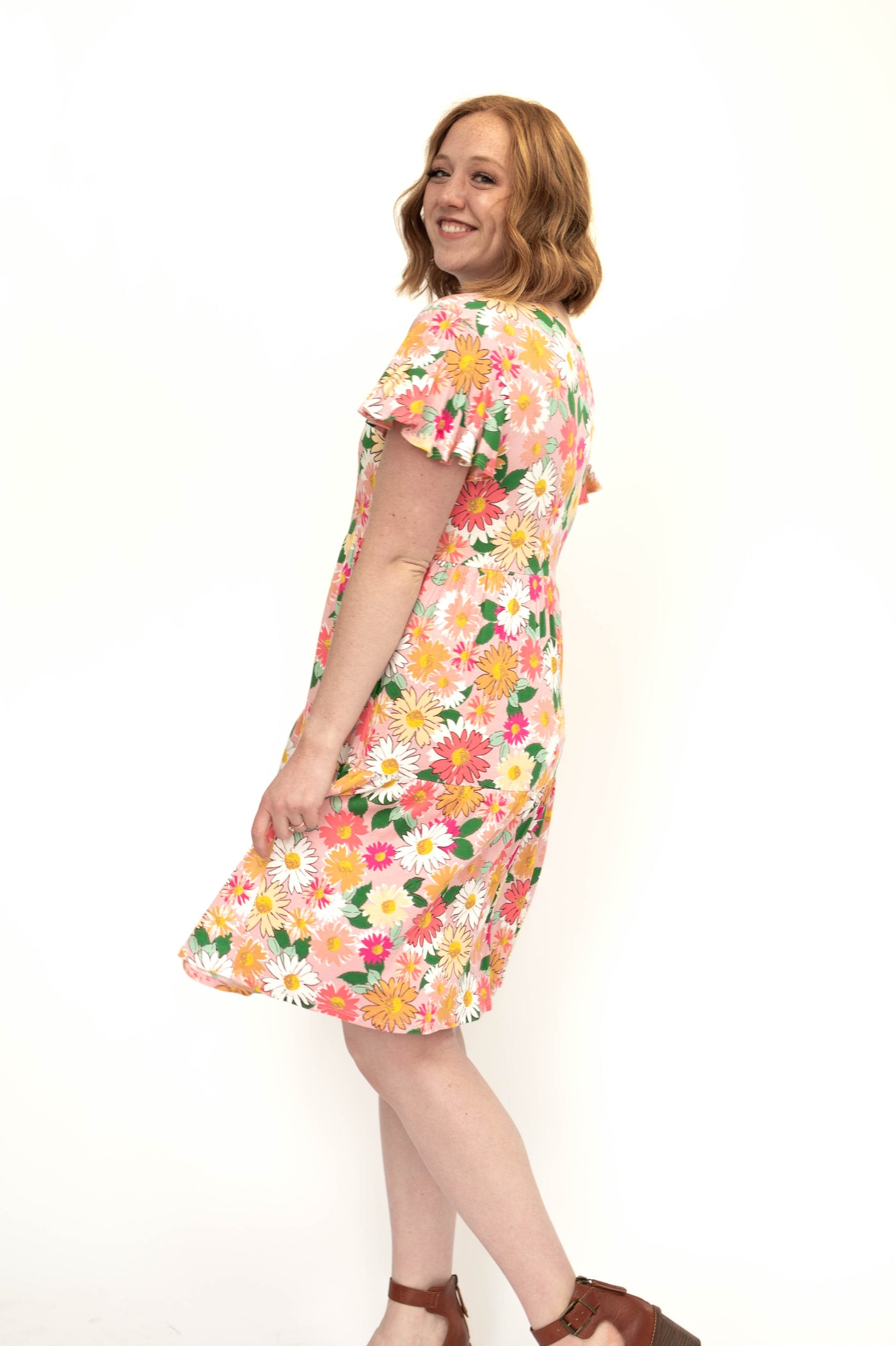 Knee length medium pink floral dress with short sleeves