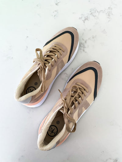 Tan sneakers with taupe, black and peach accents