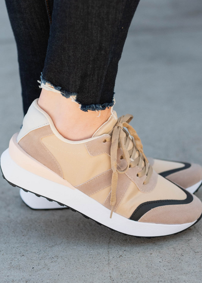 Side view of the tan sneakers