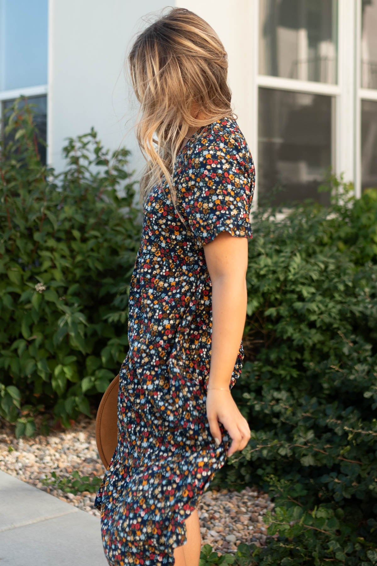 Side view of a navy floral dress