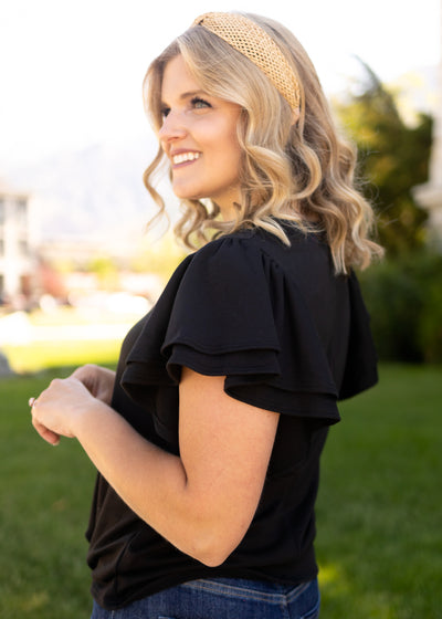 Side view of a short sleeve ruffle top