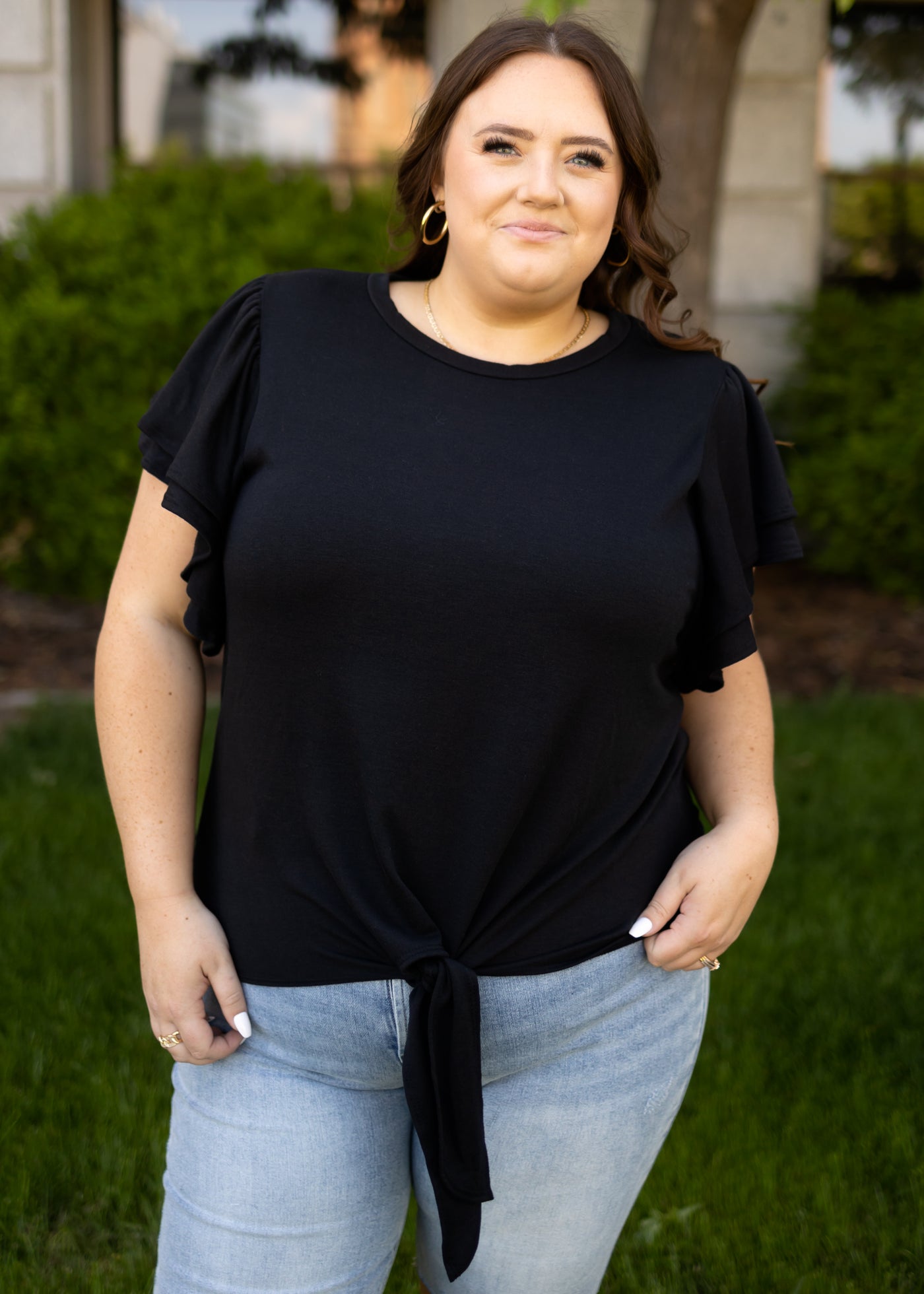 Plus size short sleeve black top that ties at the waist