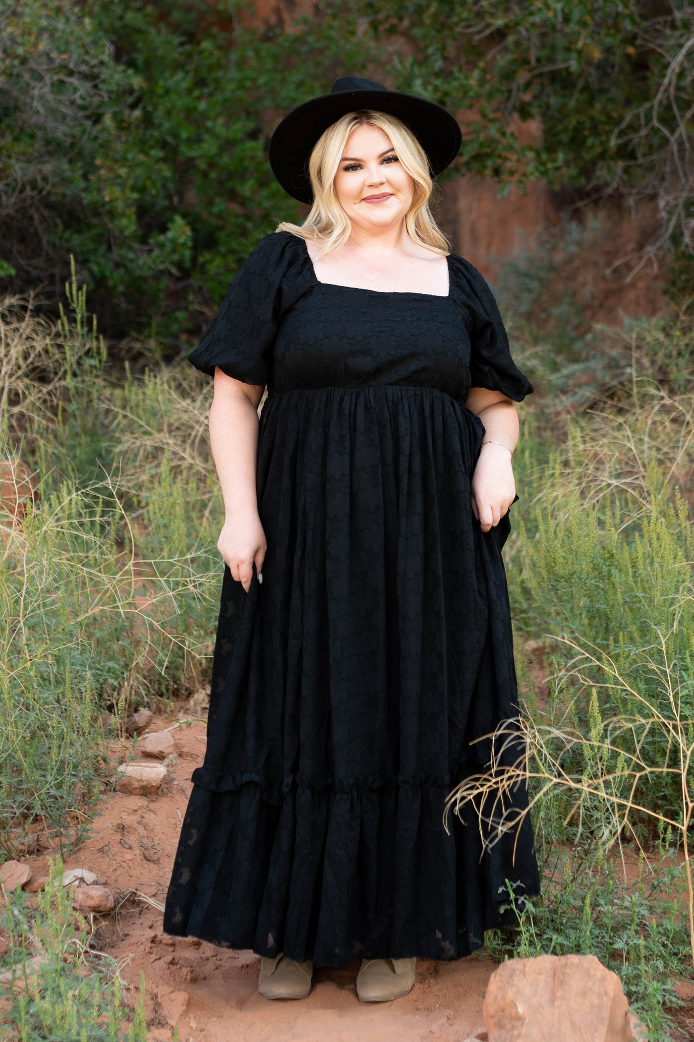 Long plus size black dress with short sleeves and a square neck