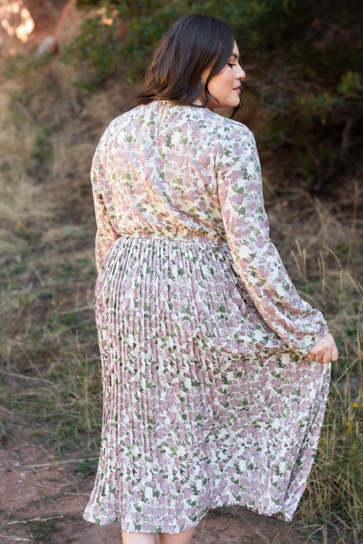 Back view of a plus size mauve floral dress