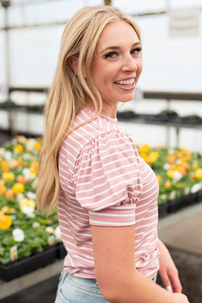 Side view of a mauve knit top