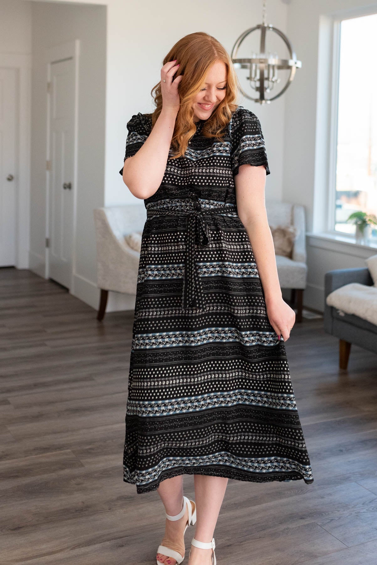 Black pattern dress with short sleeves and tie at the waist