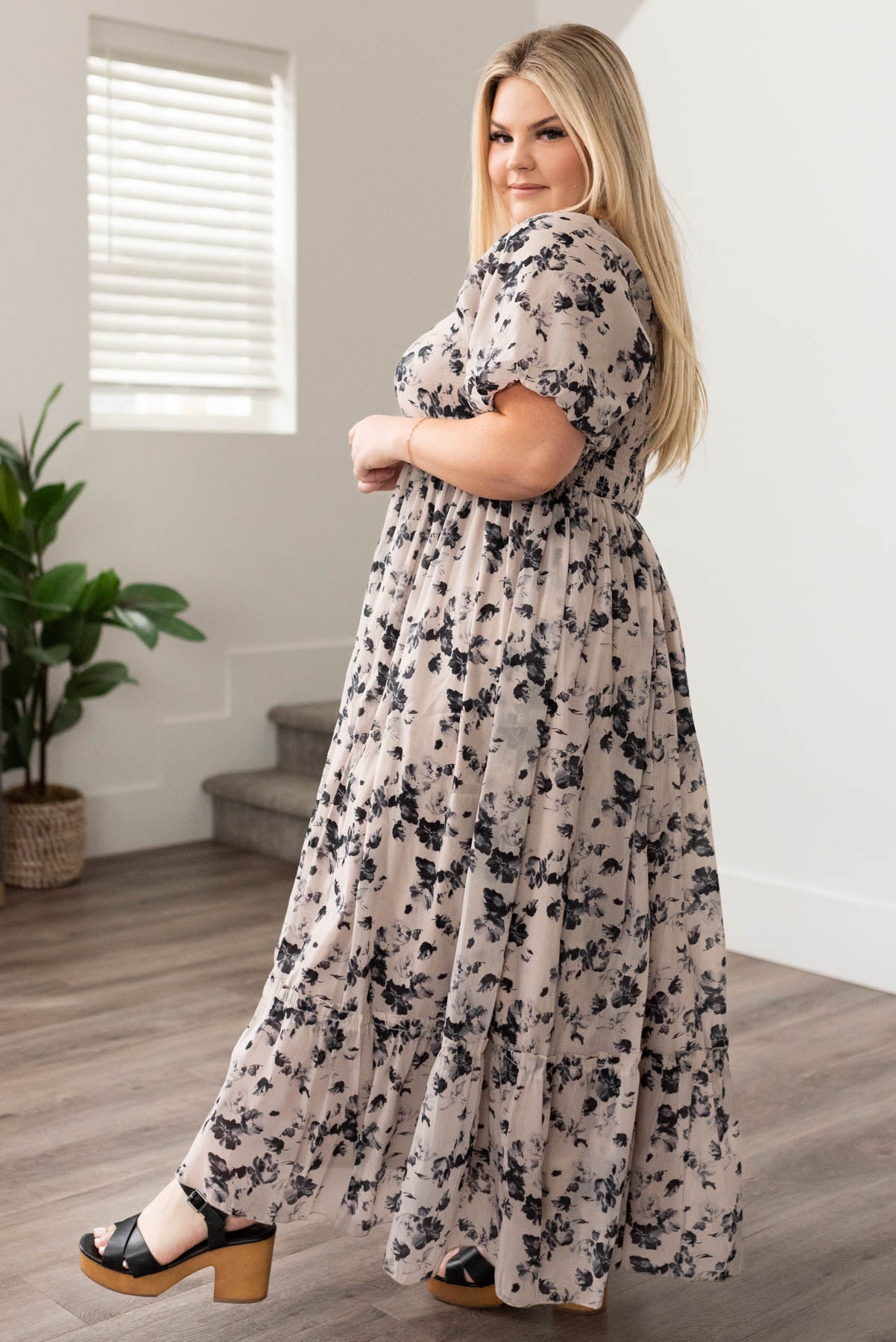 Side view of a plus size floral dress
