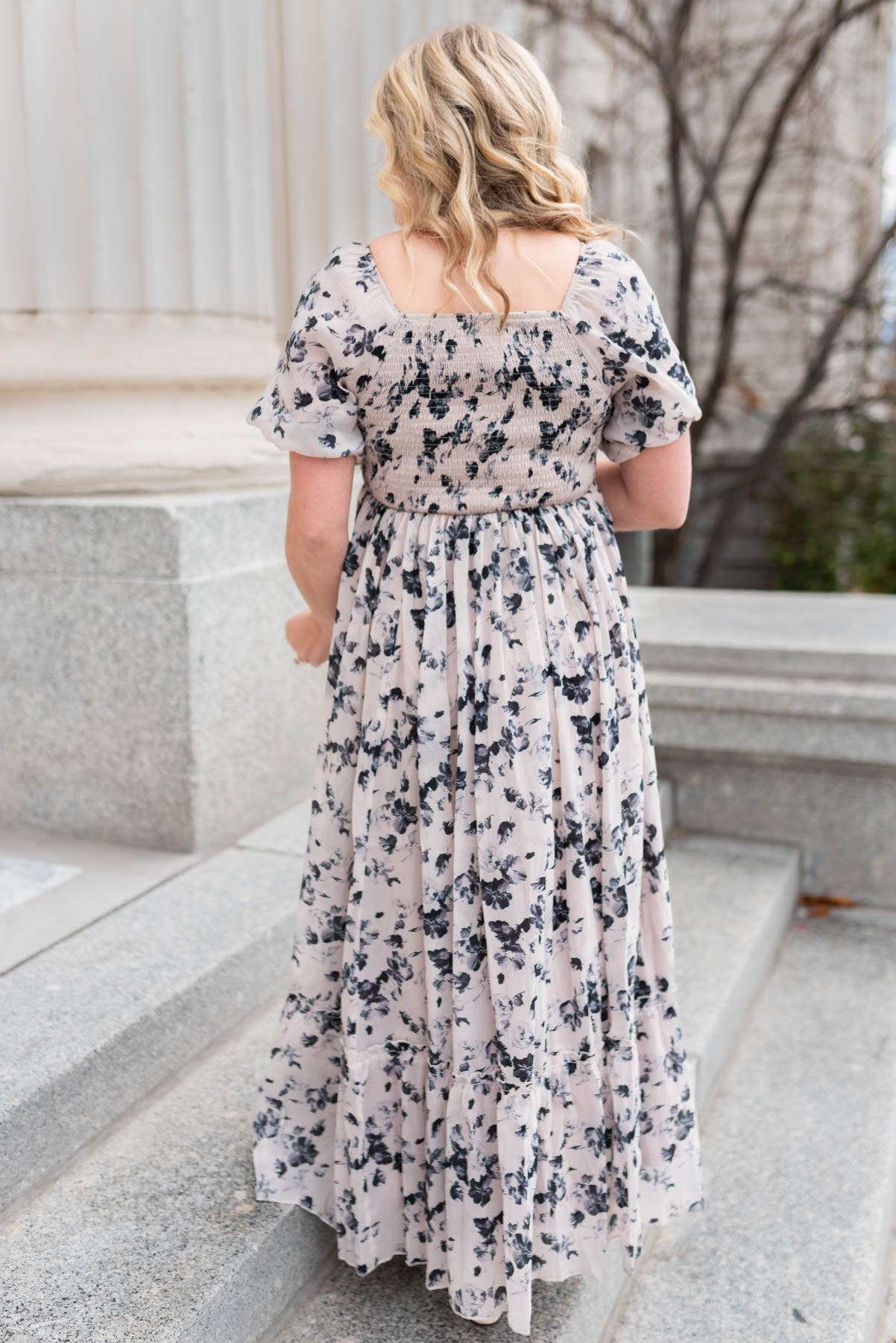 Back view of  a short sleeve floral dress