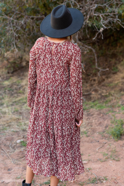 Back view of a burgundy floral dress