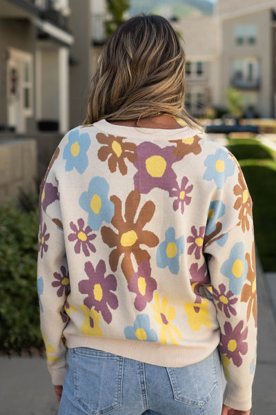 Back view of a cream sweater