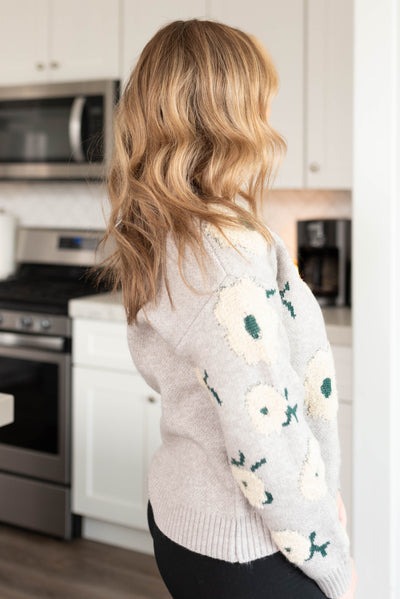 Side view of the grey floral sweater