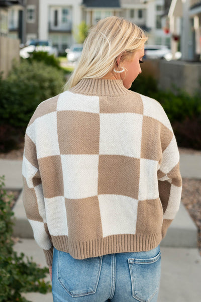 Back view of a ivory sweater