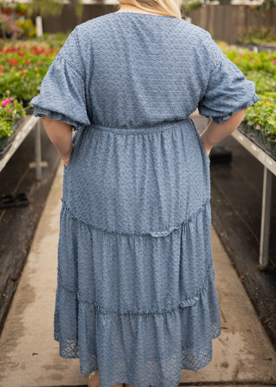 Back view of a plus size denim blue dress