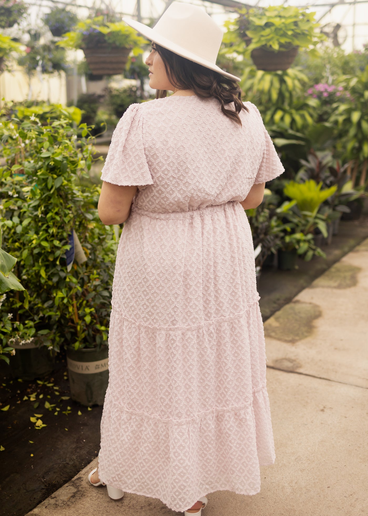 Back view of a 1x dusty pink dress