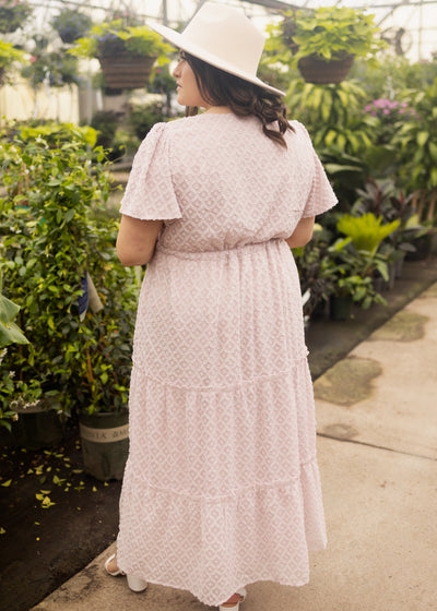 Back view of a 1x dusty pink dress