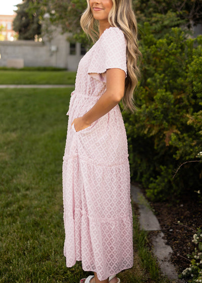 Side view of a dusty pink dress with short sleeves