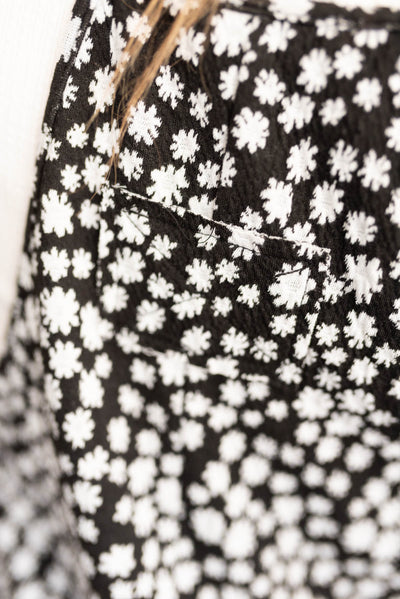 Close up of the fabric on the black floral overalls