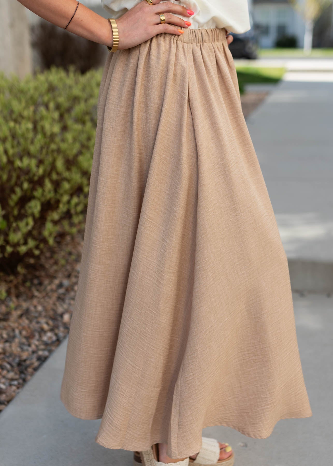 Side view of the tan hight waist skirt