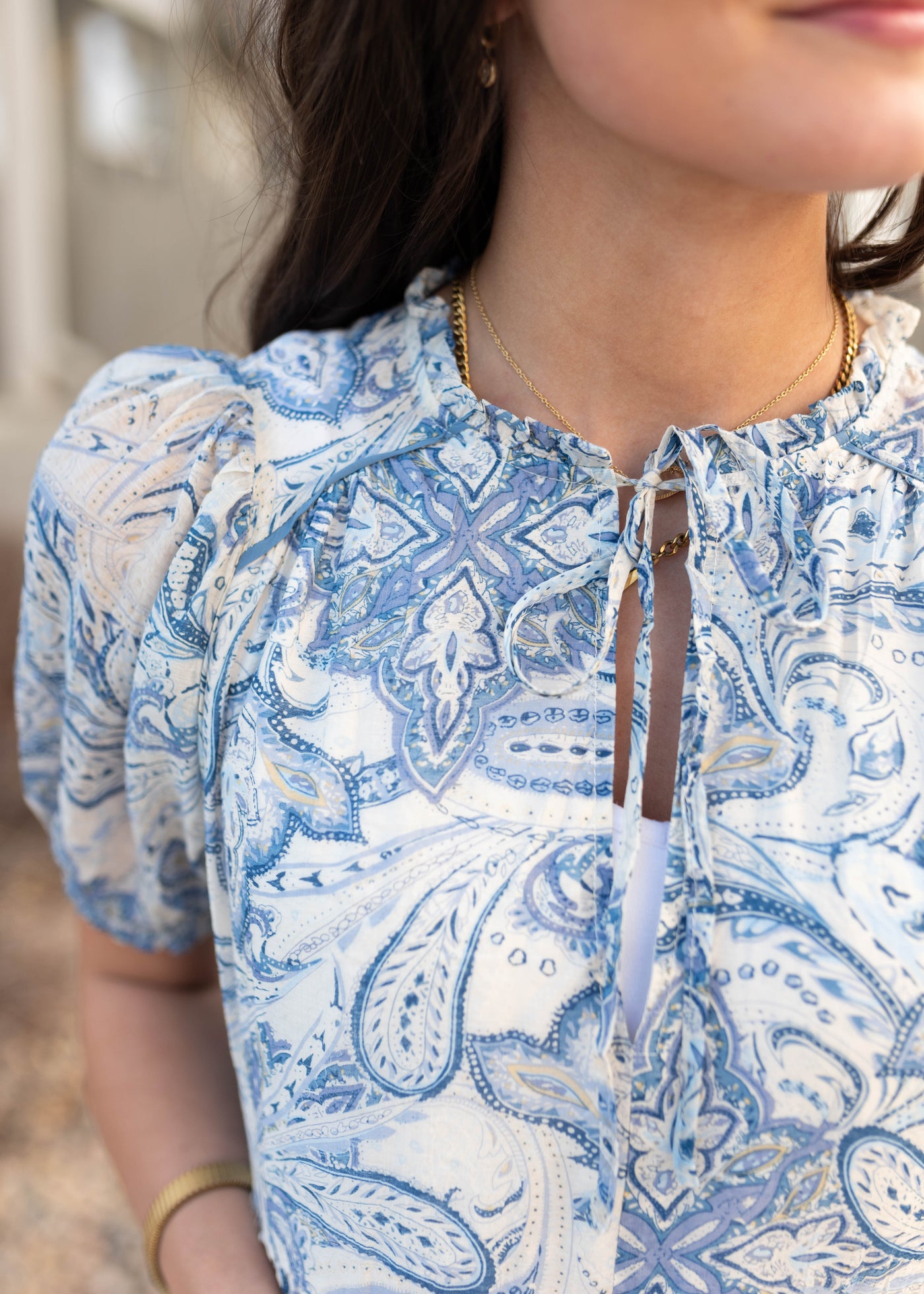 Close up of the fabric on the blue paisley pattern dress