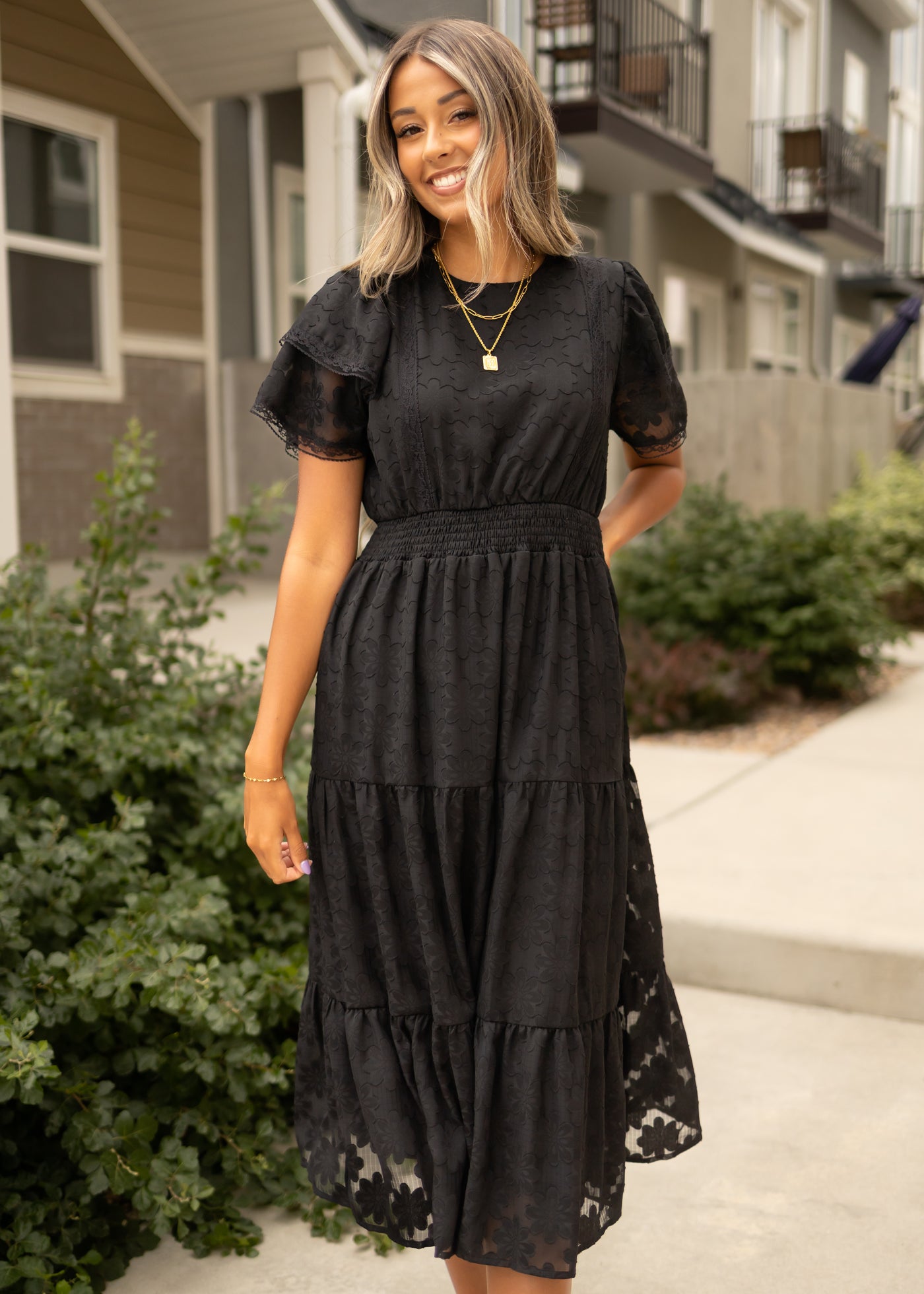 Short sleeve black floral dress with short sleeves and tiered skirt