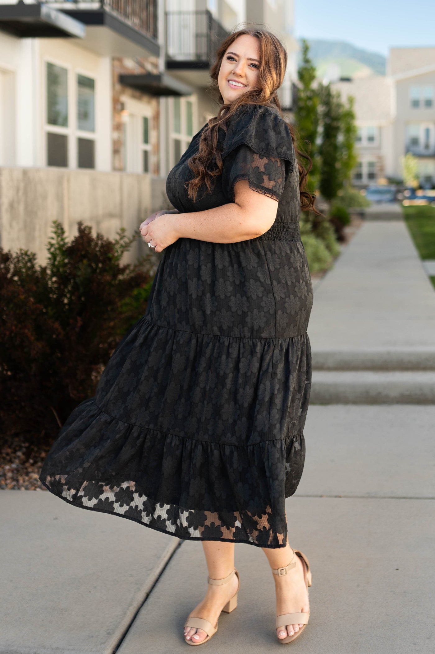 Plus size black floral dress with tiered skirt
