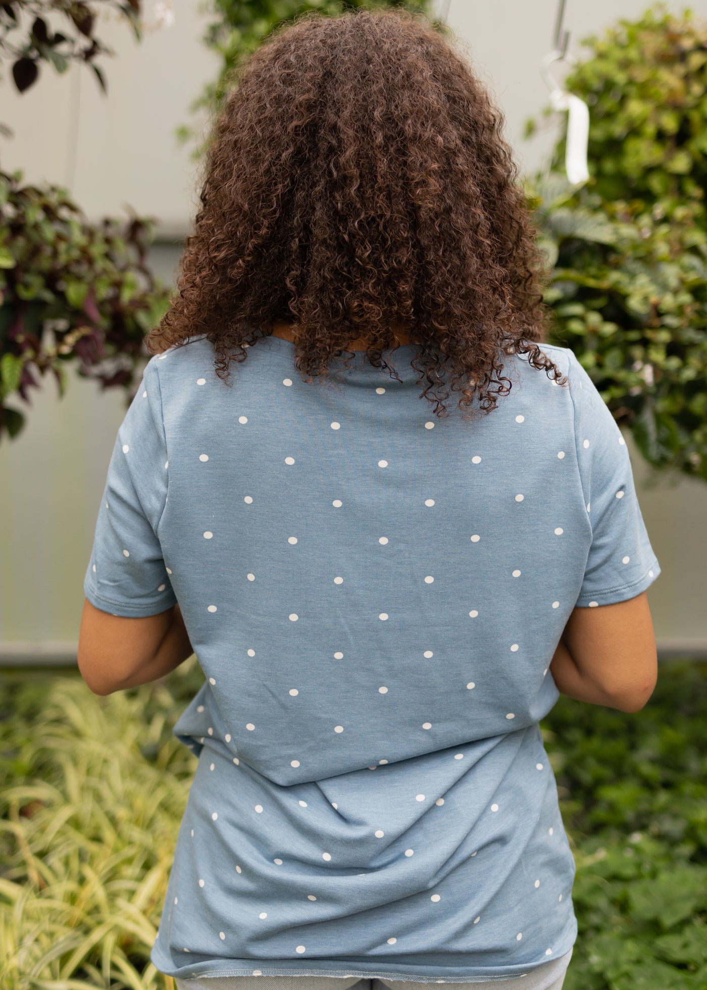 Back view of a chambray top with white dots