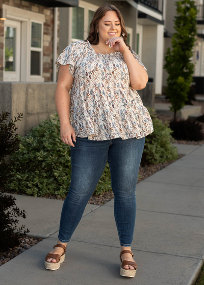 Curvy medium skinny jeans with ivory top that is sold separately