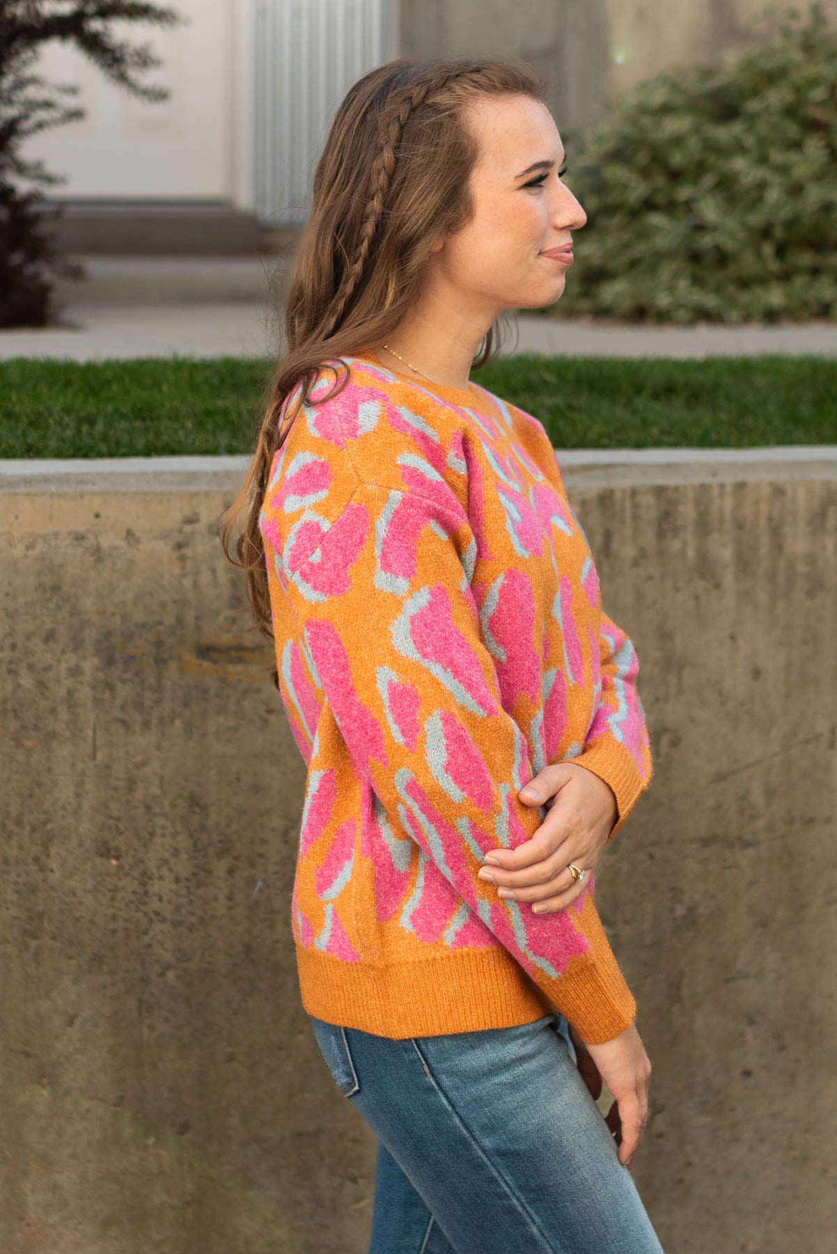 Side view of a orange sweater
