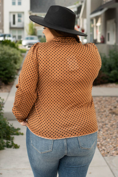 Back view of a plus size brown turtle neck